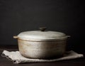 Aluminum old cauldron on a wooden table Royalty Free Stock Photo