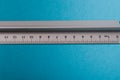 aluminum ruler on blue background