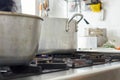 aluminum saucepan and cast-iron cauldron on a gas stove Royalty Free Stock Photo