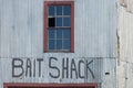 Aluminum siding and broken windows on an old new England working