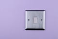 Aluminum switch plate on wall Royalty Free Stock Photo