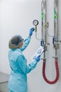 The operator checks the equipment for the production of sterile Royalty Free Stock Photo