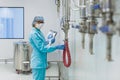 The operator checks the equipment for the production of sterile Royalty Free Stock Photo