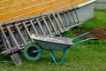 Aluminum trolley with crushed stone in the village