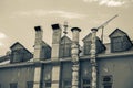 Aluminum ventilation and heat smoking pipes outside the old Industrial building. Black and white, sepia vintage Royalty Free Stock Photo