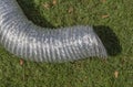 Aluminum ventilation pipe on green grass for temporary use i