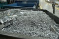 Aluminum waste resulting from pieces of aluminum metal being processed by cutting, cnc processing. Royalty Free Stock Photo