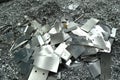 Aluminum waste resulting from pieces of aluminum metal being processed by cutting, cnc processing.