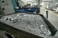 Aluminum waste resulting from pieces of aluminum metal being processed by cutting, cnc processing. Royalty Free Stock Photo