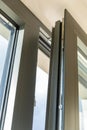 Aluminum window open detail. Metal door frame closeup view