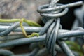 Aluminum wire twisted on stone object, macro background Royalty Free Stock Photo