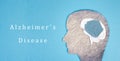 Alzheimer disease is standing on a paper, silhouette of a head with a damaged brain, dementia diagnosis, ParkinsonÃÂ´s awareness