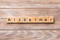 Alzheimer word written on wood block. Alzheimer text on wooden table for your desing, concept Royalty Free Stock Photo