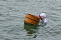 Ama female diver working on the sea