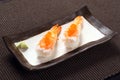 Amaebi sushi with wasabi on ceramic dish, sweet boiled shrimp wi