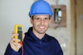 amale electrician showing multimeter Royalty Free Stock Photo