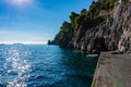 Amalfi coast with rocky shore and boat by pier in mediterranean sea, Positano Royalty Free Stock Photo