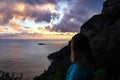 Amalfi - Woman enjoying the sunset over island of Mediterranean sea on Amalfi Coast in Italy, Europe.