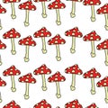 Amanita mushrooms in horizontal rows seamless pattern, spotted mushrooms with red cap and dots on a white background Royalty Free Stock Photo