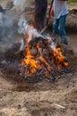 AMARANTE, PORTUGAL - 20 APRIL 2022: Stage of covering with soil of the bonfire with the pieces of clay piled up during the cooking Royalty Free Stock Photo