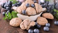 Amaretti cookies with almonds and blueberries. Traditional Cookies from Sardinia, Italy, served with Mirto liqueur.