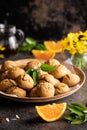 Amaretti di Saronno cookies on wooden plate on beautifully decorated table - food aesthetic concept