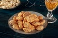 Amaretti, traditional Italian almond cookies, with a glass of Amaretto liqueur and almonds