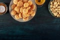 Amaretti, traditional Italian almond cookies, with a glass of Amaretto liqueur, shot from the top with copy space