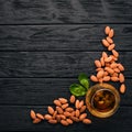 Amaretto Almond Liquor. Almond On a wooden background. Italian drink Top view.