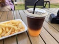 amaricono orange juice french fries , Tomato sauce and mayonnaise delicious dish on wooden table background.