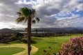 Amarilla - Panoramic view from Amarilla golf course on cloud covered Pico del Teide and volcanic crater landscape on Tenerife