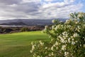 Amarilla - Panoramic view from Amarilla golf course on cloud covered Pico del Teide and volcanic crater landscape on Tenerife