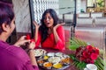 Amased and surprised indian woman feeling happy to get proposal from her boyfriend in restaurant. i said yes