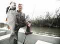 Fisherman holds the Asp fish Royalty Free Stock Photo