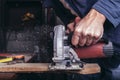 Amateur carpenter uses the power saw Royalty Free Stock Photo