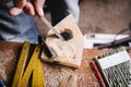 Amateur carpenter uses a wood file