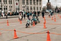 Amateur competition of children to balance bicycle on Lenin Square. A boys and girls on balance bicycle