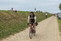 Amateur Cyclist Riding on a Cobblestone Road - Tour de France 2015 Royalty Free Stock Photo