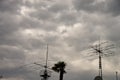 Amateur radio antennas above the roofs of houses.