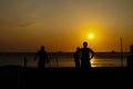 Amateurs playing football at Jumeira beach in Santa Marta, Colombia during sunset Royalty Free Stock Photo