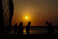 Amateurs playing football at Jumeira beach in Santa Marta, Colombia during sunset