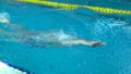 Amator female athlete doing butterfly stroke during training in indoor swimming pool, Slow motion, Full HD steady shot