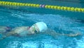 Amator Swimmer Practicing in Water Swimming pool.