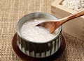 Amazake and a wooden spoon on the table