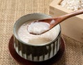 Amazake and a wooden spoon on the table