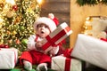 Amazed attractive baby in the Christmas costume. Royalty Free Stock Photo