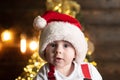 Amazed attractive baby in Christmas costume, close up face. Royalty Free Stock Photo