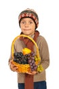 Amazed autumn boy with grapes Royalty Free Stock Photo