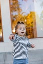 amazed baby girl in striped long Royalty Free Stock Photo