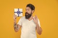 amazed bearded man hold present box in studio. bearded man hold present box